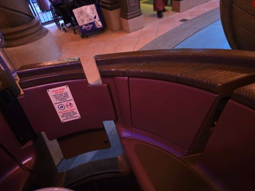 Size of regular door Close-up of a maroon seating area with safety instructions visible.