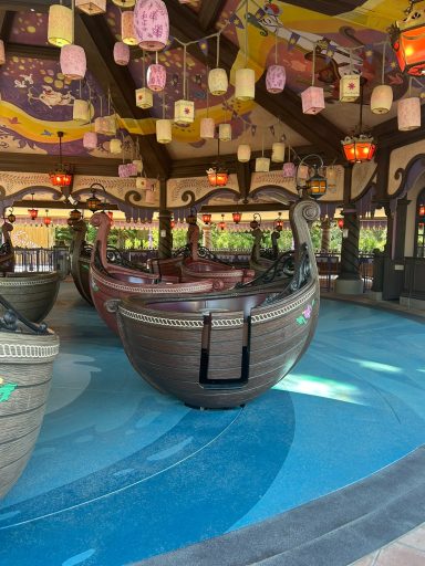 The standard entry door Image of a tangled themed boat shaped ride vehicle