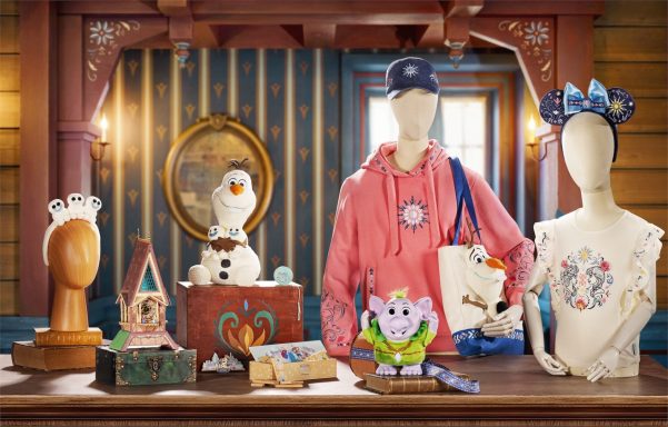 Display of various Disney-themed merchandise, including clothing and collectibles.
