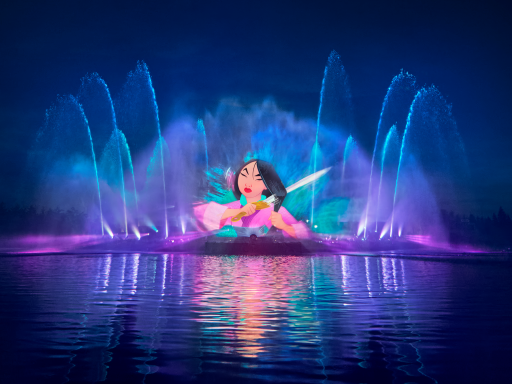 Colourful water fountain display featuring a character surrounded by vibrant lights.