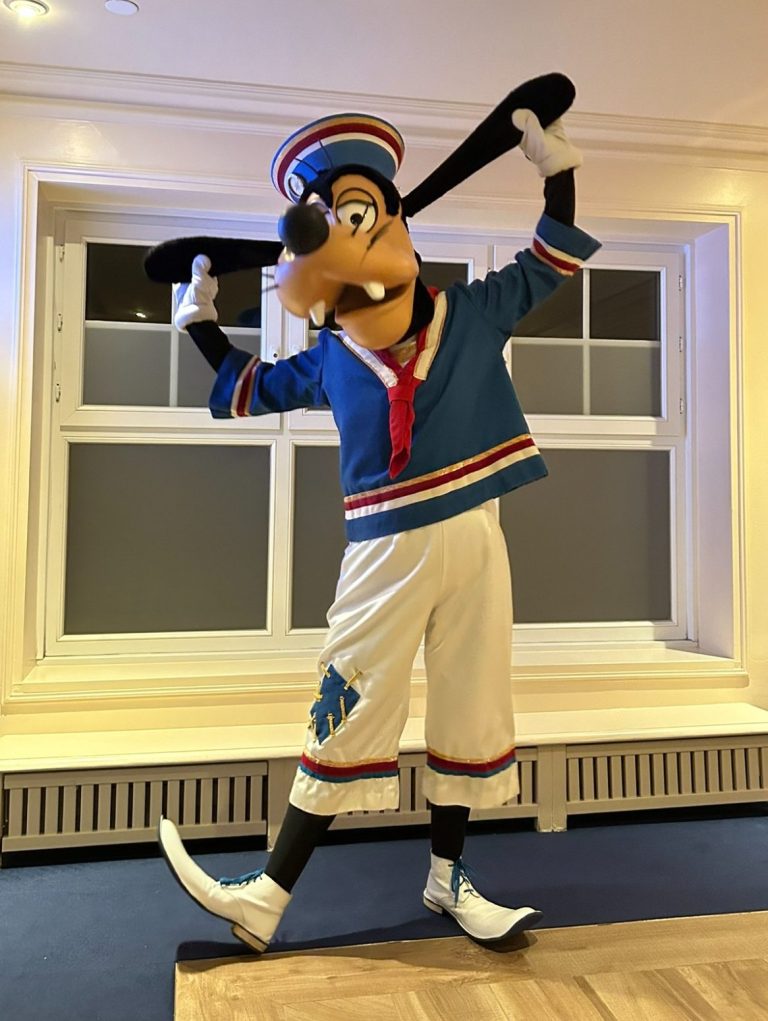 Goofy in a sailor outfit striking a playful pose.